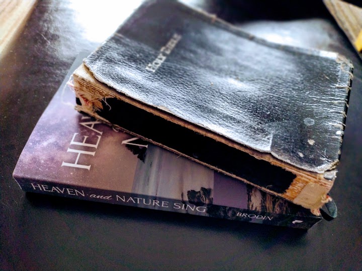 A Bible with "Heaven and Nature Sing" devotional book